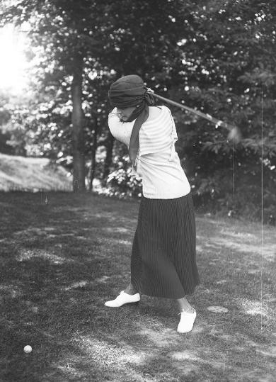 Minna Rider playing golf in France, 1920